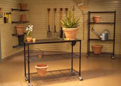 A room filled with pots and plants on the floor.